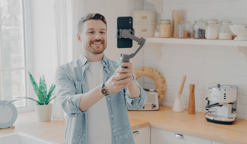 man is recording his kitchen on the phone camera