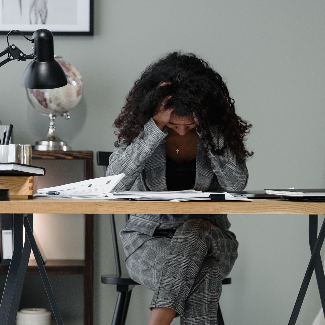 a woman is studing some documents