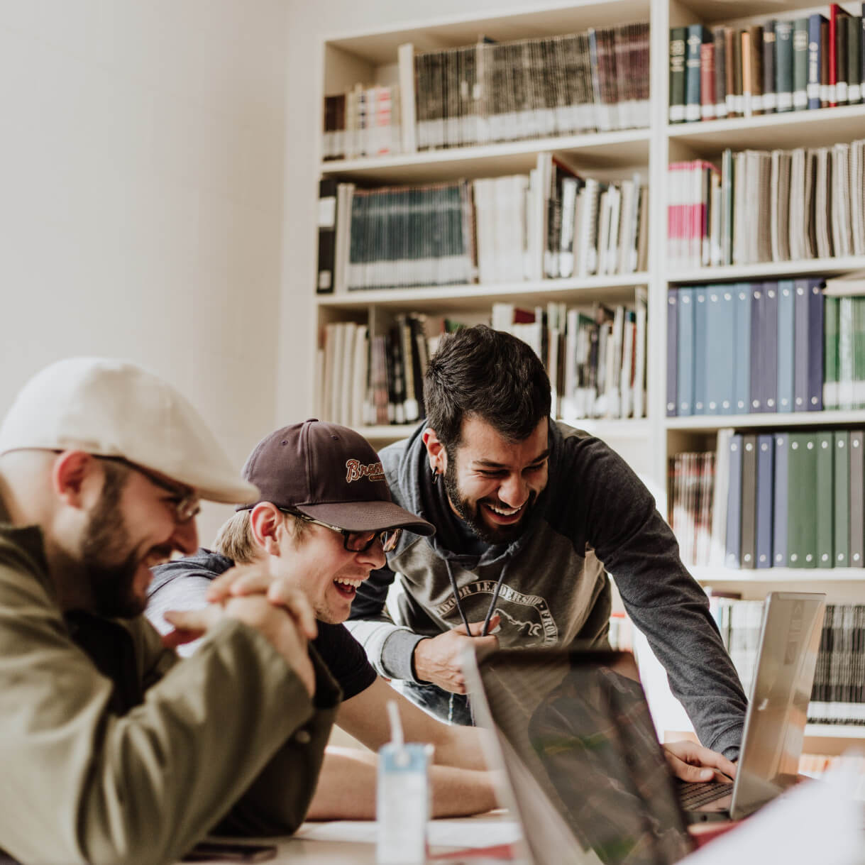 students laugh at the library