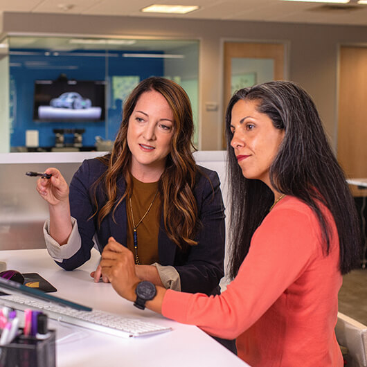 two women are working in the office