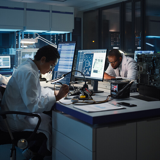 A young female scientist working on a research in a modern laboratory